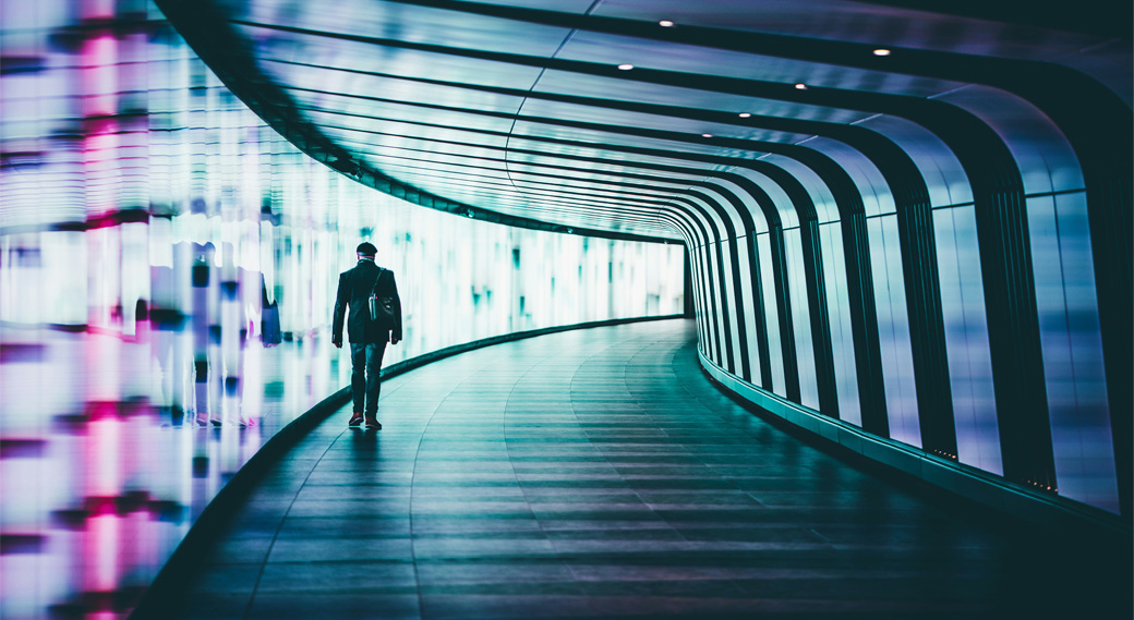 People walking down a futuristic aisle