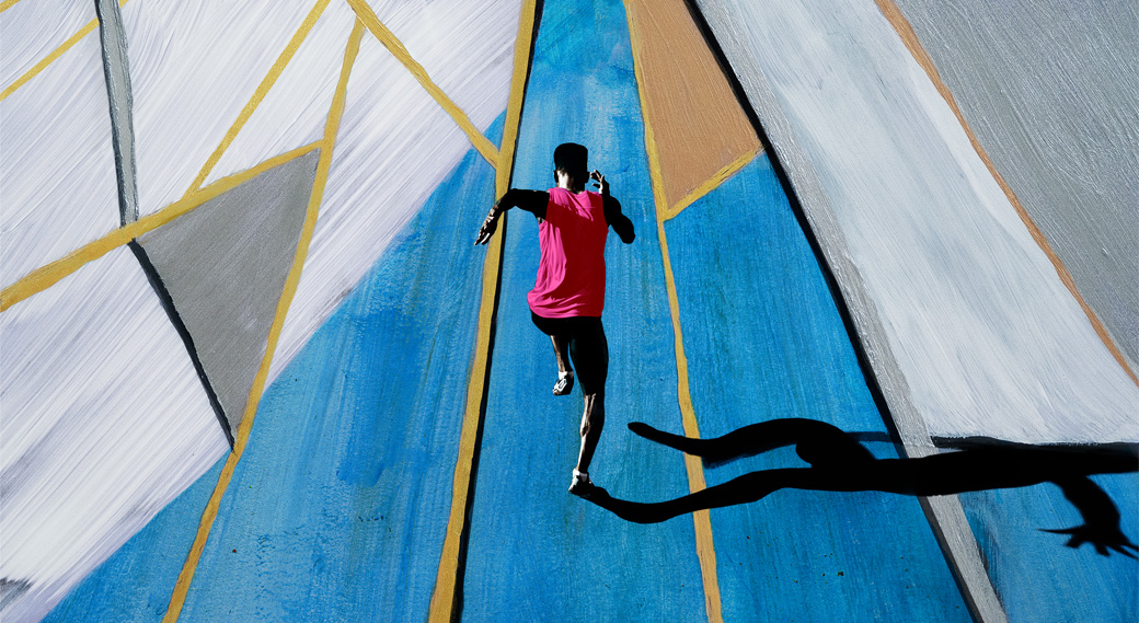 Male athlete sprinting, shot from above